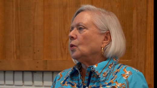 Emily standing in front of a cabinet